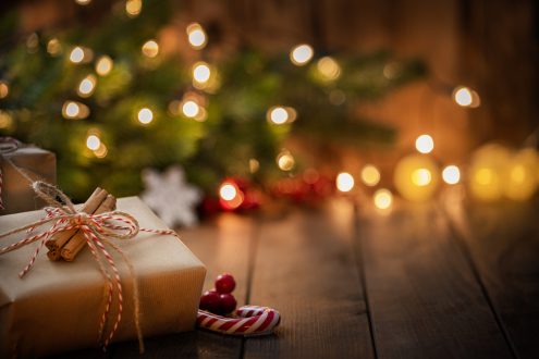 Brown Christmas gift box on rustic wooden table. High resolution 42Mp studio digital capture taken with Sony A7rII and Canon EF 70-200mm f/2.8L IS II USM Telephoto Zoom Lens